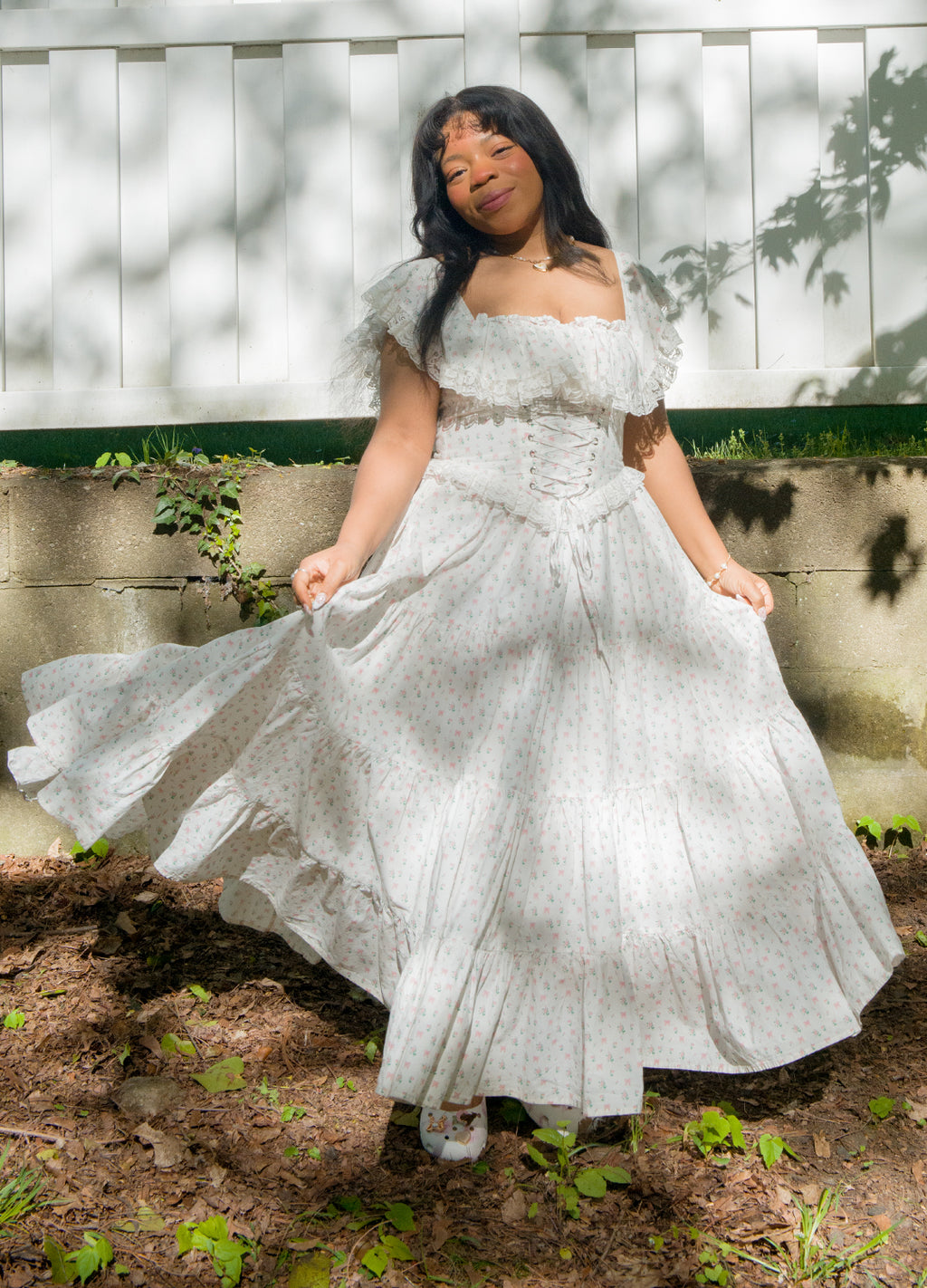 white wedding dress with pink roses A-line wedding dress with off-the-shoulder straps and pink flowers
